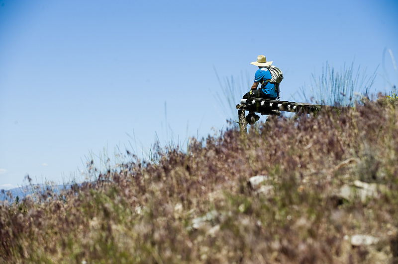 This was the last drop of the line. Here, Ryan contemplates on whether to put the three hours of labor into it to make it ridable, as the landing is peppered with huge boulders hidden amongst the tall grass.