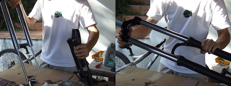 <span style='font-size:20px'>Step 21.</span> Align the stanchions with the fork lowers and very carefully slide them past the outer dust seals. It can help to start on an angle to prevent tearing the rubber dust seal. This may take a few tries.