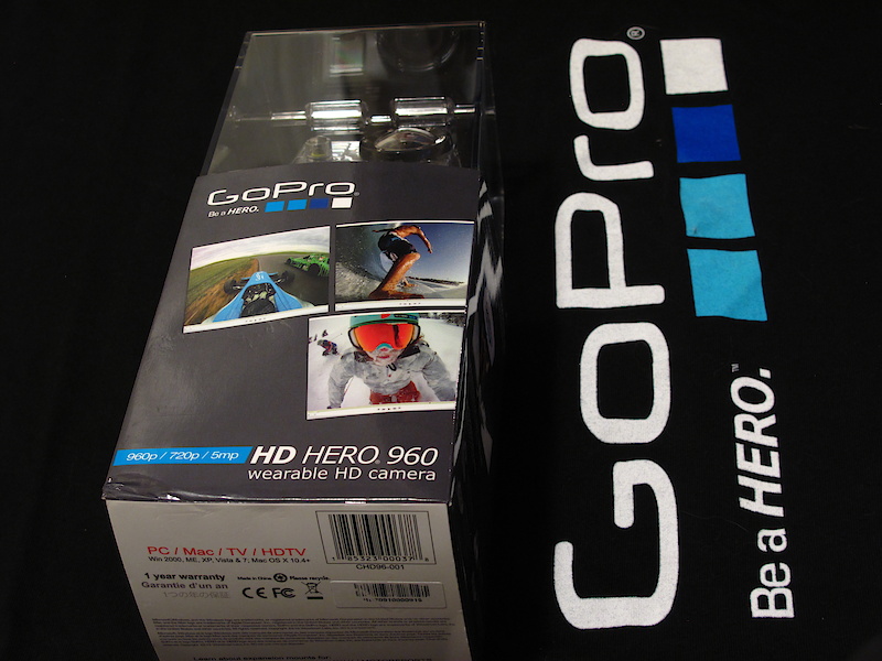 The big news at GoPro this year was the introduction of a second HD model that has been added to help bring the same near-bombproof HD video to the masses at a very attractive pricepoint. Here's a run-through of the goods. The new camera, the HD Hero 960 is designed to be price conscious with simplicity in mind. GoPro has cut out a few options (1080p, 60fps recording and the Hero Bus expansion port) to bring it in at an even lower price. It keeps its 720p and 960p at 30 fps, and also retains its 5 megapixel photo function. The cutback in features on the 960 equates to a rather large cut in price. The HD Helmet Hero released last year retails for $299.99USD while the new 960 starts shipping to retail stores this week for just $179.99USD.