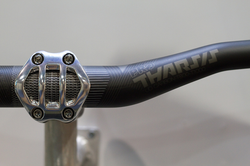 There is a Tharsis bar as well, done in carbon, naturally. It uses the same matte finish as the stem and post and is made using unidirectional carbon with a titanium reinforced center section. If you don't have enough titanium or carbon on your bike yet, these bits would be an easy way to remedy that! The 710 mm wide bar has 20 mm of rise, 8 backsweep, and 4 upsweep. Total weight of 195 grams.