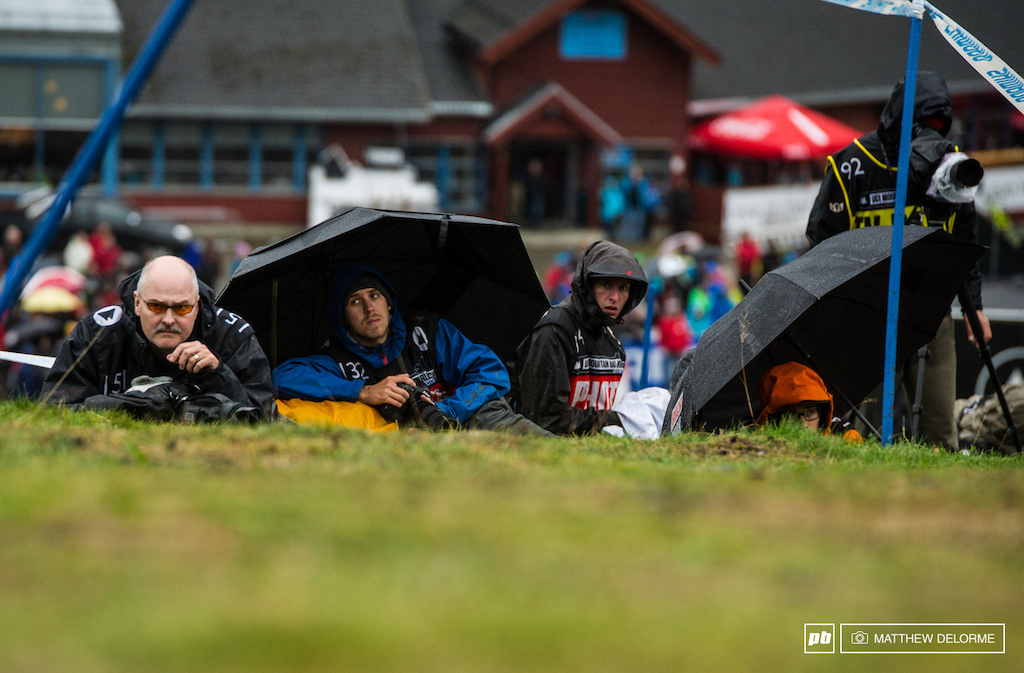 Nearly the whole of the World Cup photo core stayed huddled up to keep hypothermia at bay in the driving wind and rain.