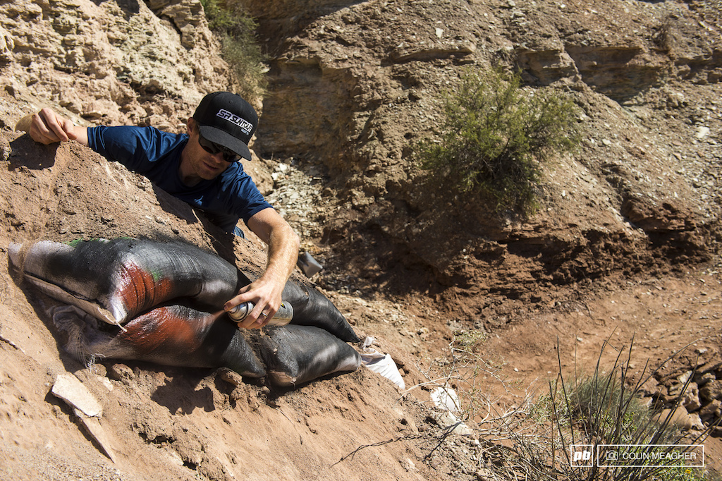 Dan Dacko doing his best to hide the unsightly sand bags from the view of the TV cameras.