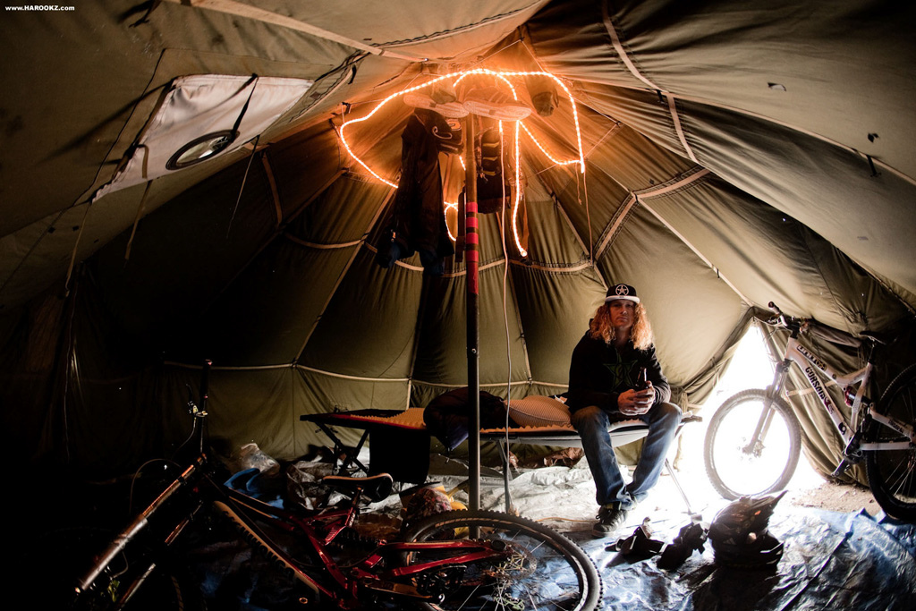 Sleeping in a ten person army tent, camping and roughing it to keep the budget under control... it sounded like a text book experience for all of us outdoors men. We raced inside the tent and unrolled our thermarests and sleeping bags to claim our ground. Some pimped their quarters with an extra layer of foam while others splurged for the Ritz Carlton way, upgrading to a fold out camping cot. Upon re-entering the super-canvas on our first night, we had a cold and dank welcoming due to a torrential downpour that flooded the ground and soaked every piece of sleeping gear we had. Everyone had overlooked the holes in the tent, sending VanDine and Porter into the trailer where the bikes were stored. I decided to switch over to the Ford-Seasons (F-350) while Kelly McGarry who knows a thing or two about really roughing it took it like a man, making the soggy quarters his bitch for the entire trip.