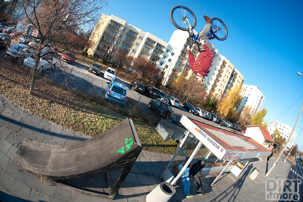 Piotrek Krajewski backflip at the bus stop with his Quinnie. Photo by Jan Kili ski. Ride Your Way 2 Bling.