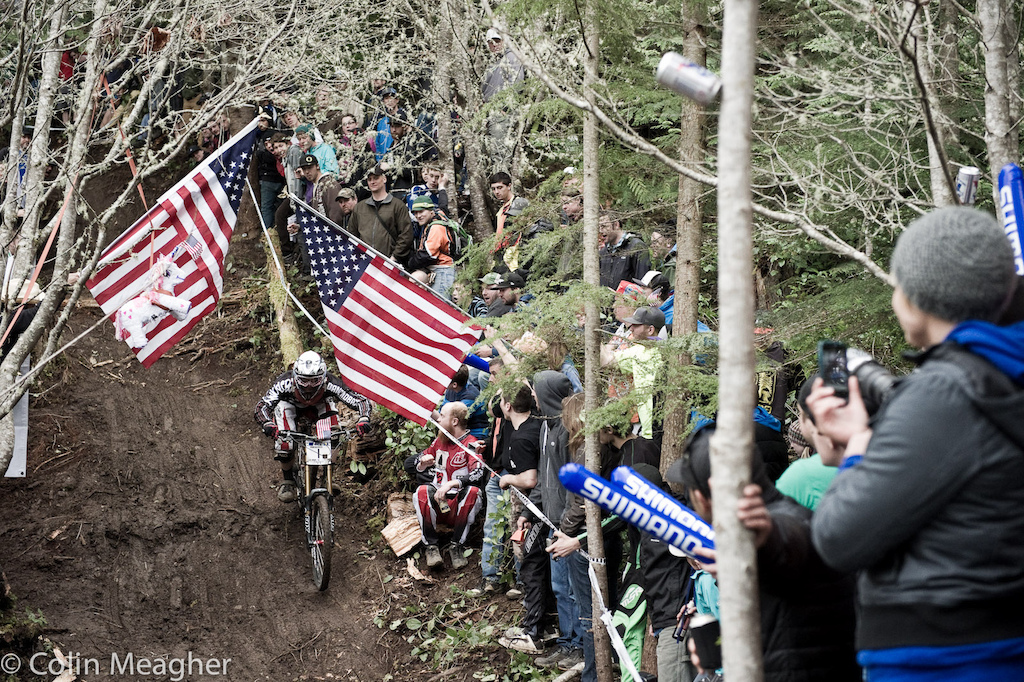 Title Sponsor Diamondback s Kyle Thomas parting the red white and blue curtains in the waterfall line.