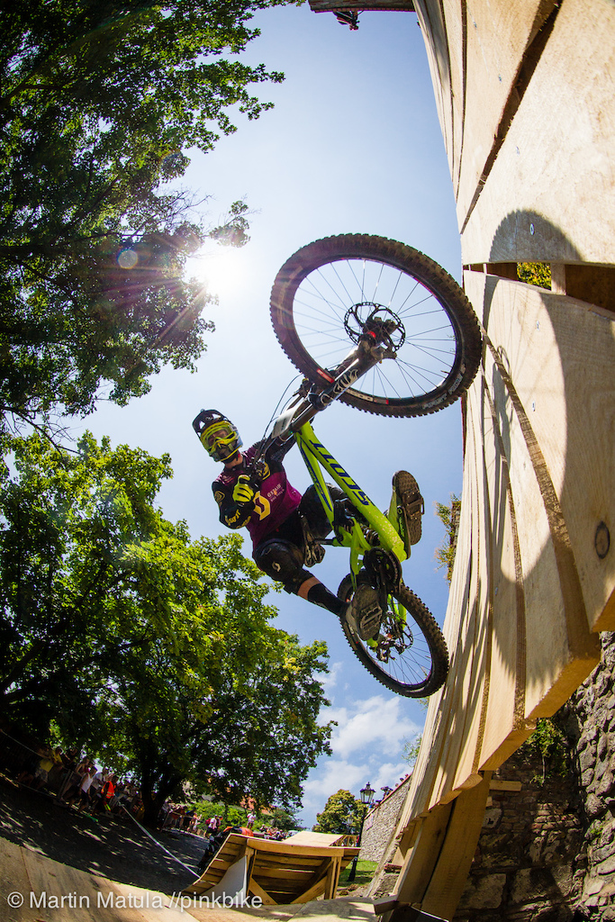 Brendan Fairclough an avid off-season dirtjumper showing flawless form on the sketchy wallride that would be better suited in a slopestyle course than on a high-speed downhill track.