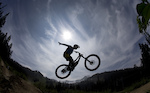 Mountain bike rider Paul Stevens is silhouetted as he rides the Whistler mountain bike park in Whistler, B.C. Monday, August 13, 2012. THE CANADIAN PRESS/Jonathan Hayward