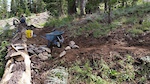Rebuilding the Vista trail after a flash flood destroyed most of it.  Building up the log berm.