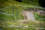 The new start comes in at an angle and leaps over a berm into the bikepark track for a series of berms instead of the old mix of off camber rocks and grass.