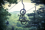 Downhill mountain bikers ride the chairlifts at Marquette Mountain Ski Area in Marquette, Michigan.