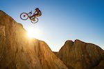 Kirt Voreis does a barspin in the California desert on his mountain bike.