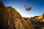 Kirt Voreis does a one handed table in the California desert at sunset on his mountain bike.