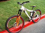 The little bike got new sneaks...

2008 Transition Revolution 32s in danger red with 2.35 Maxxis Minion DHF front and rear.