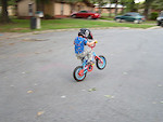 Dylan practicing wheelies less than 5 minutes after the traing wheels came off the bike.