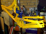 Custom respray by Argos Cycles (http://www.argoscycles.co.uk/) in Sunset Yellow with linkage and spring done in blue.