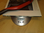 scale shot of a 2010 Answer Pro Taper DH 780mm 1" rise,

obviously the weight of the book's not included, go to love "high tech" scales :D