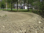 One man, a shovel, and a pick axe. An early spring season and mild weather has given me some time to work on and ride the pump track. Still building and fine tuning, but it is riding and draining very well. April 26, 2010.