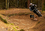 Chris taking the berm with Dai closely following.