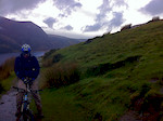 We rode up Snowdon via the Rangers path. It was very wet, windy, cold, and grey. We had gale force winds, fog, rain, snow, and hail on the way up, but we made it in just over two hours, pushing and carrying for at least half of it. 
The ride down was epic, brutal, and technical, and only took about 13 minutes riding time.