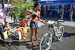 Beautiful girls know how to wash their bikes!