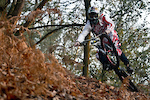 Front wheel in the air turned a little bit in the leaves and stuff