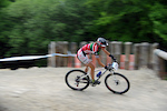 Sweeping shot of an XC rider on a corkscrew on the dalby 4x track
