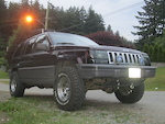 grand cherokee
2' lift / 31 " BFG mud terrain km
15 " steel wheels, 1 1/4" spidertrax
4.0L AMC staight six,k&amp;n filter, heavy duty ignition coil, and heavy duty bosch starter. smoked headlights and taillights, fog lights, no cat-exhaust with magnaflow tip. tow hooks. 2x 12 inch jensen subs, 400w alpine amp, orion speakers, infinity tweeters, wired throught the firewall.