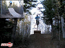 hiting an awsome jump at the towers on tabor mtn    14 feet  gap tip to tip 
extreamly well bit first part of NEW trail.     Towers in the backround ;-)