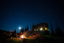 Matt Yaki, Jordie McTavish and Rylan Kappler around the fire after a long day on the trails at Sol Mountain Lodge.