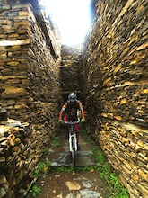 Crossing an ancient village stone passage and I know people will love to be here once with their bikes.