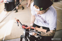 Cam Zink giving his new carbon YT a fresh sticker job. Note the brace around his left hand, broken only a week ago and cut the cast off early to ride.