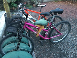 Photo of a bicycle in the Galapagos Islands with a wood child seat.
