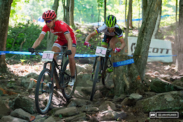 Gunn-Rita Dahle Flesjaa trying to make the pass on Annika Langvad in the rocks on the first lap, unfortunately it didn't go so well and Gunn-Rita was temporarily slowed by the stump.