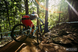 Rachel Atherton drops into the rock garden bright and early for the first run of the week.