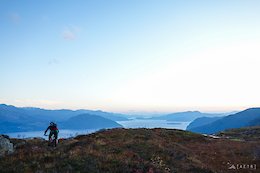 Jan riding into the late evening sunset over Hardangerdjord up in Norway after a ride exploring new trails up Grubbafjellet.