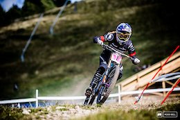 Rachel Atherton pushing on through the final fast grass corners during her timed training run which would place her fastest.