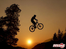 Jumping at sunset with the smoke from the fires.