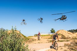 Photobombing Africa's toughest race in style. Theo Erlangson & Justin Novella jump over Cape Epic riders, while being chased by a helicopter.