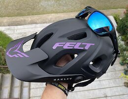 The Oakley DRT5 has an integrated "Eyewear Landing Zone" that secures your glasses on the helmet. Oakley claims to be able to use this system while riding, but I personally would only ever use it if I were standing around, say fixing a flat. While riding 1. I would actually wear my eye protection. 2. I would be worried to break my (Expensive REAL Oakley prescription shades) in a crash and/or tree branches!

Speaking of glasses, another reason that I chose the Oakley DRT5  is the fit of the glasses. There is more room and a more comfortable fit on this helmet compared to the Fox Speedframe & Speedframe Pro Helmets, especially the newer Speedframe Pro, which presses on the sides of your glasses, and even though "on paper" the Fox helmets, are a little less than the Oakley, they are front-end heavy, and press down on, or at least tap against, the top of the glasses pressing them against the bridge of your nose. The DRT5 never does this. The DRT5 just stays put on your head. Leave it to a company whos main product is eyewear, to get that aspect correct.