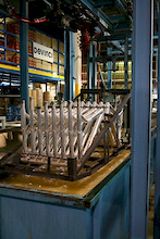 Devinci Factory Tour - Frames about to dunk into the first tank.