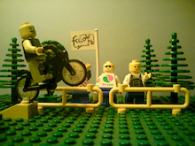 jumping ! :) he does have a helmet on, just a clear lego one ;)