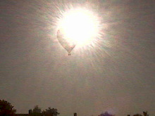 Balloon crossing the sun.