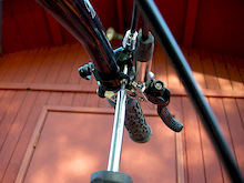 Loosen the remote control clamp with a T20 Torx wrench enough so it will slide around the handlebar.