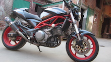 cagiva raptor 1000
red frame and wheels 
custom termignoni exhaust system
full carbon kit
and lots more