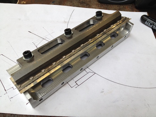 Reverse over varnish metering blade assembly