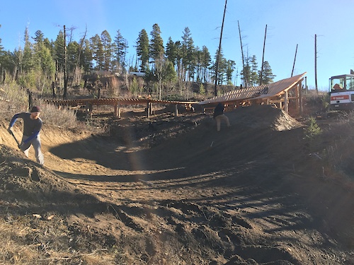 "The Seperator" technical trail feature is finally completed. Big structure, lots of lumber, lots of work but super fun. Splits the trail into two lines. Option 1, gap jump, takes you into a sweet gully and option 2, wallride, takes you along a few hip jumps and a bench cut trail section.