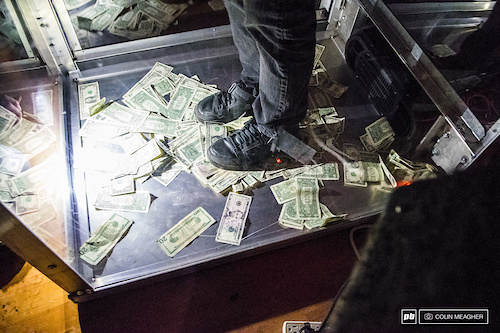 Take note: Adam Craig made damn sure to step on the largest denomination bill he could find.