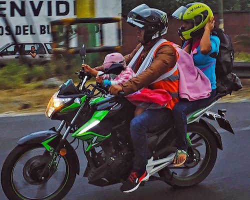 Fully loaded motorcycle on the road near Escuintla. Motorcycles are the most popular transport. Photo – Juan Delaroca