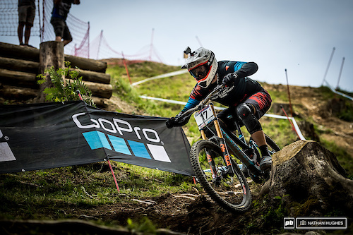 Austria's great hope, Markus Pekoll, hammering the loam between the stumps before the hall of fame section.