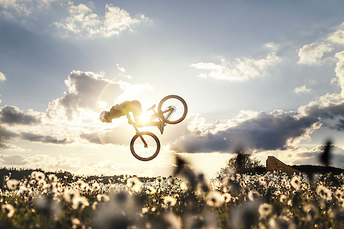 Dandelion dirt jump spot with a stunning sun set in the backyard of the local golf course.